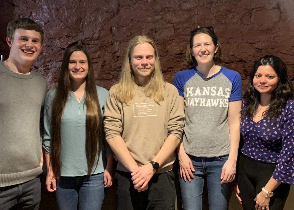 Future graduate student standing next to 4 members of the Hartley lab