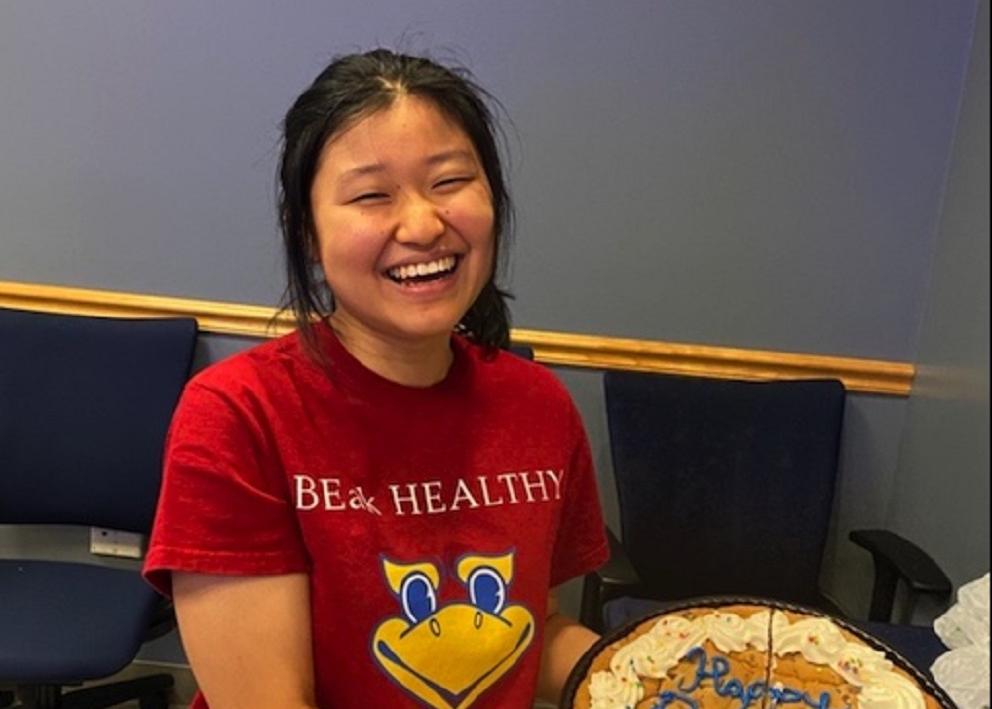 Hiroko holding a cookie cake for her birthday