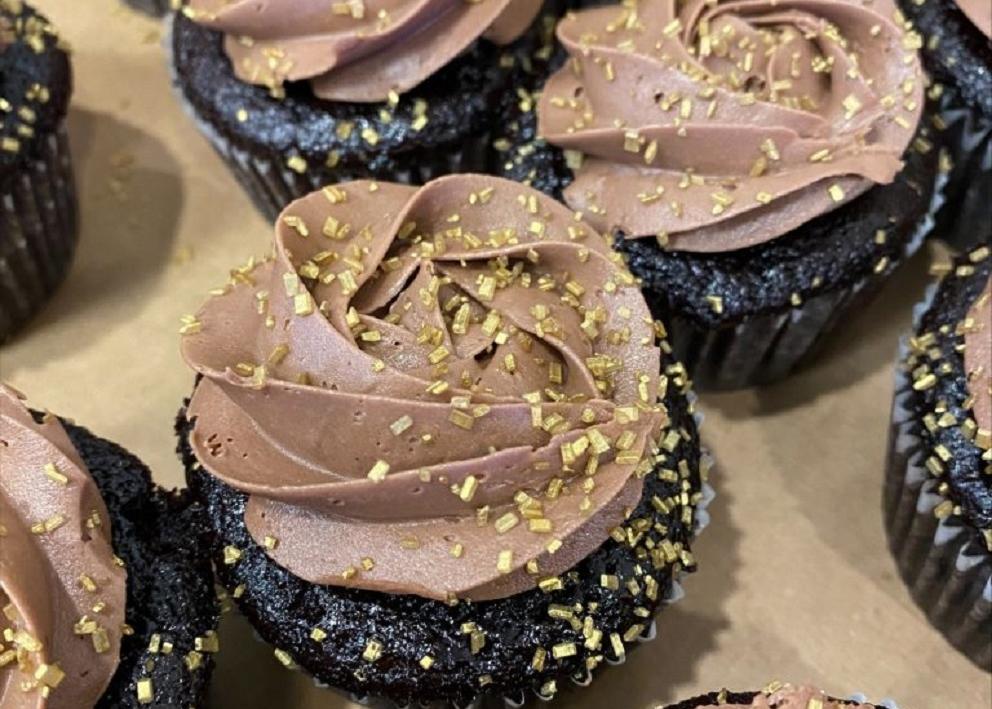 Chocolate cupcakes with gold sprinkles