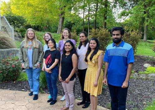 Lab members standing outside, smiling for a picture