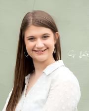 Woman in white shirt smiling